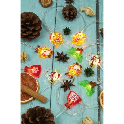 SNOW BOOM El. garland with “New Year’s heroes” attachments, 2m, 10LED, champagne, permanent candles, PVC transparent, 2xAA